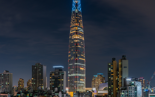 Illuminated Skyscraper Dominating the Night Skyline from Chrome web store to be run with OffiDocs Chromium online Illuminated Skyscraper Dominating the Night Skyline from Chrome web store to be run with OffiDocs Chromium online